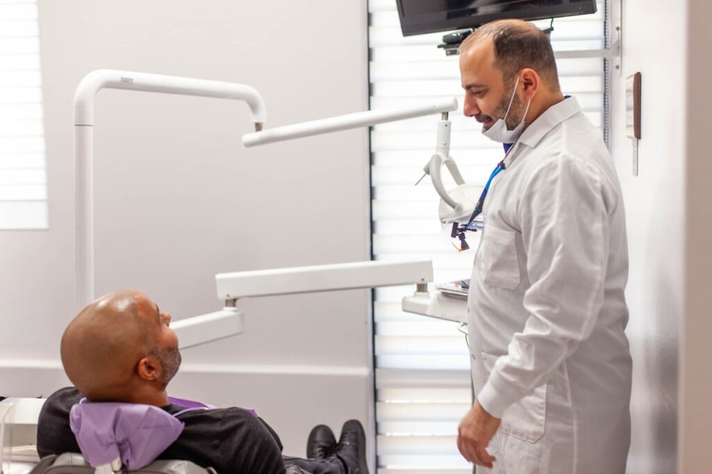 Dental hygienist using a scaler during a routine teeth cleaning at A-Dental Center in North Hollywood